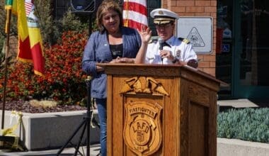 LA Fire Chief Kristin Crowley speaks at Station 112 on Fire Service Day, joined at the podium by Yolanda Regalado, recipient of the Honorary Fire Chief award