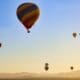 Many hot air balloons flying on the sky at sunrise in Temecula, California USA