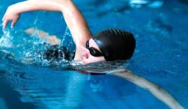 Medium shot of a female swimmer in action