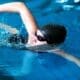 Medium shot of a female swimmer in action