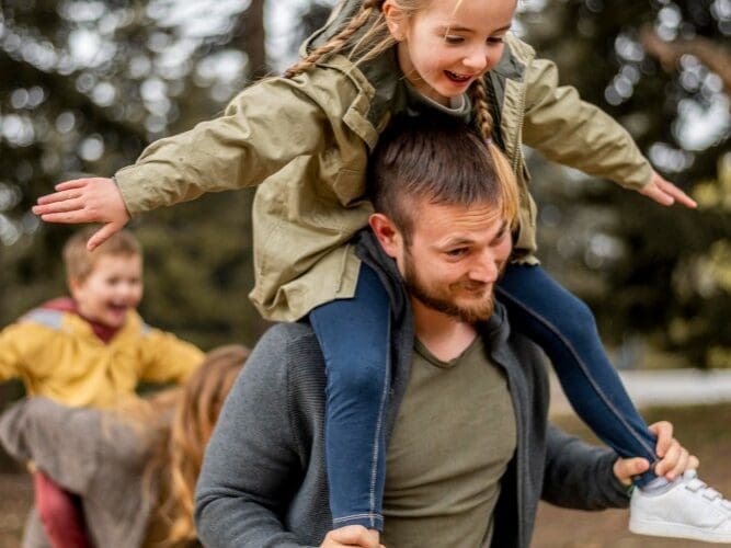 Medium shot parents and kids having fun