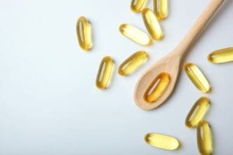 Omega capsules displayed against a gray backdrop