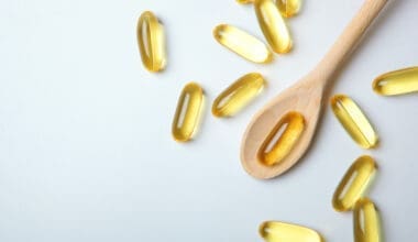 Omega capsules displayed against a gray backdrop