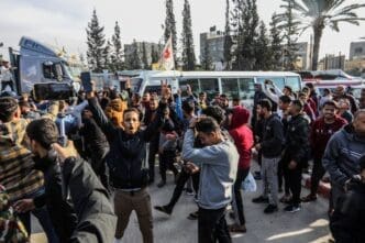 Palestinians receive prisoners released from the occupation prisons in coordination with the Red Cross, arriving in the Gaza, in the southern Gaza Strip, on January 25, 2025