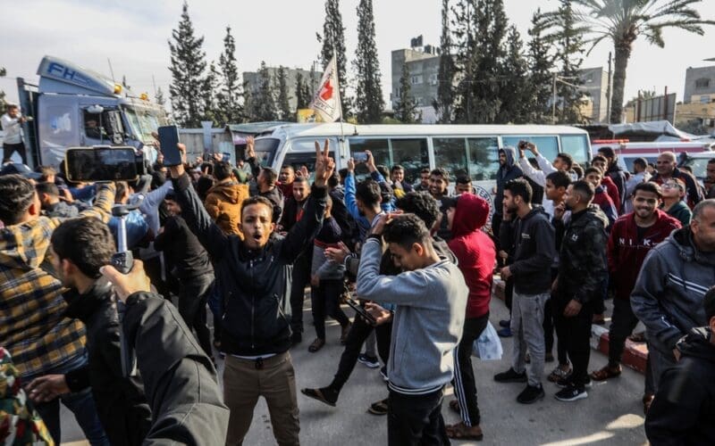 Palestinians receive prisoners released from the occupation prisons in coordination with the Red Cross, arriving in the Gaza, in the southern Gaza Strip, on January 25, 2025