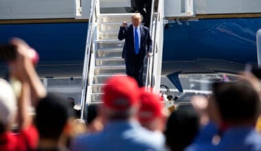 President Donald Trump waves as he steps off Air Force One at John Wayne Airport, Santa Ana, Calif., on Sunday Oct. 18, 2020