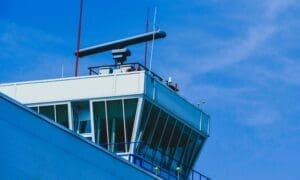 Radar station positioned above the traffic control tower