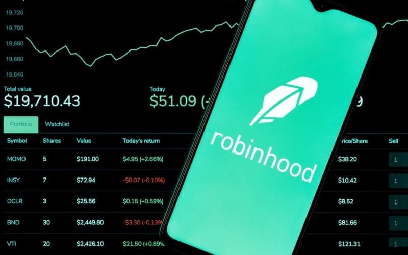 Robinhood Markets is an American broker-dealer company. A smartphone with the Robinhood logo on the background of the live trading webpage