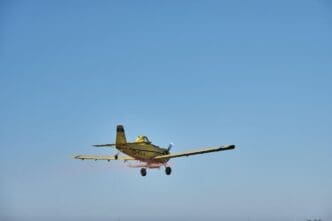 Single-engine propeller airplane flying