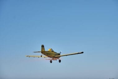 Single-engine propeller airplane flying
