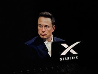 Starlink is a satellite internet constellation operated by Starlink Services, owned by spaceX.Elon musk concept in background with spaceX logo up front
