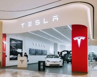 Tesla car showroom Logo sign Automotive electric vehicle company TSLA designs and manufacture