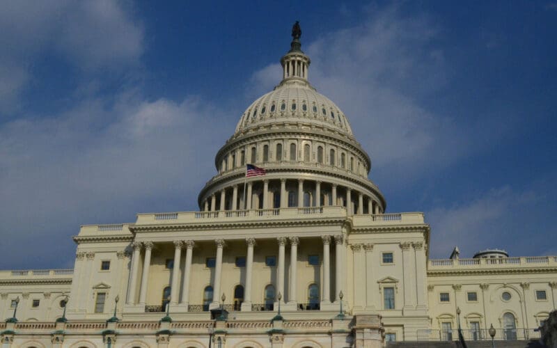 The American flag waving atop the Capitol Building in Washington, D.C