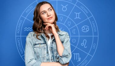 Thoughtful young woman set against the backdrop of a zodiac circle, representing astrology