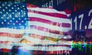 USA flag overlaid against a backdrop of financial indicators