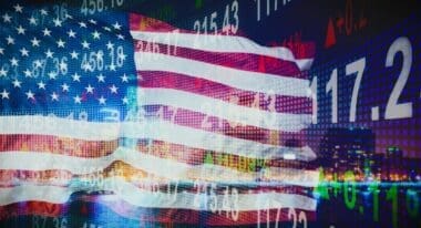 USA flag overlaid against a backdrop of financial indicators