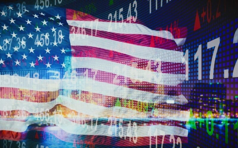 USA flag overlaid against a backdrop of financial indicators