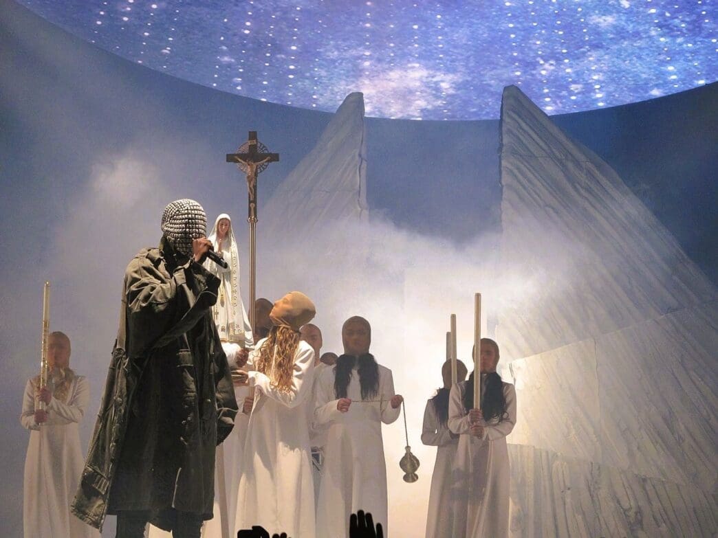 West on the Yeezus Tour in 2013. Photo by Peter Hutchins - flickr.com, CC BY 2.0, via Wikimedia Commons