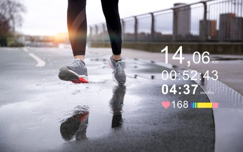 Woman running outdoors from the front, showcasing advanced statistics