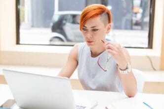 Woman with red hair in an office setting