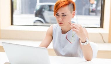 Woman with red hair in an office setting