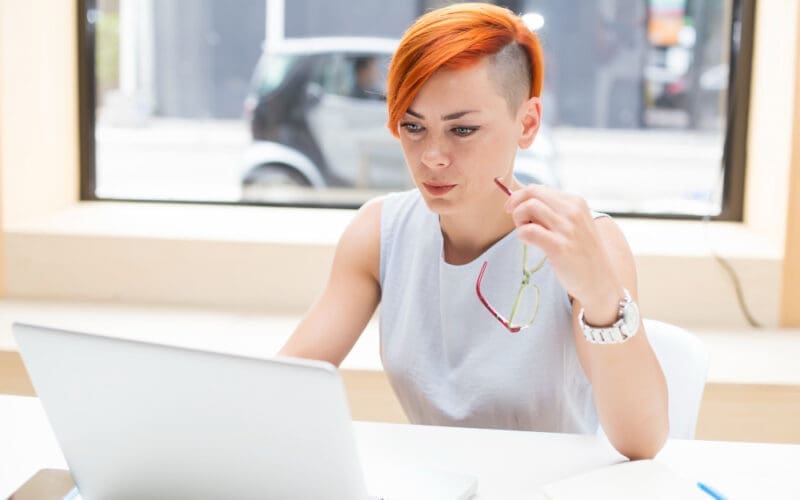 Woman with red hair in an office setting