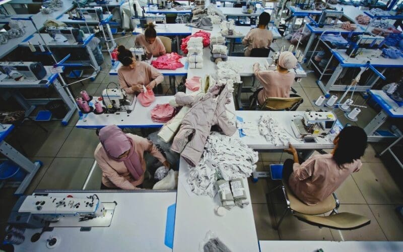 Women working in a sewing workshop, showcasing the production process in a textile factory