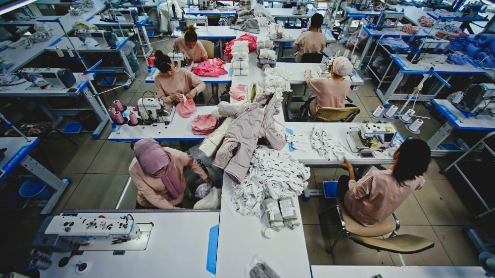 Women working in a sewing workshop, showcasing the production process in a textile factory