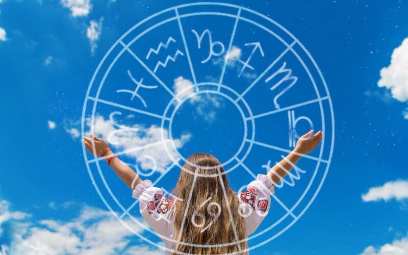 Young girl embodying success and fortune with a horoscope wheel