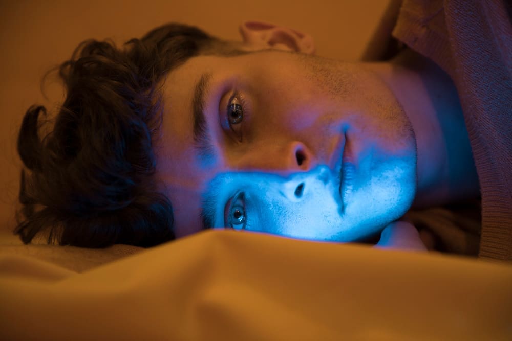 A night owl lounging in bed