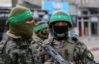 Al-Qassam Brigades members, deployed in the streets, during the 35th anniversary of the founding of the Palestinian Hamas movement, in Rafah, in the southern Gaza Strip, on December 10, 2022.