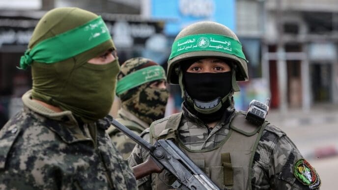 Al-Qassam Brigades members, deployed in the streets, during the 35th anniversary of the founding of the Palestinian Hamas movement, in Rafah, in the southern Gaza Strip, on December 10, 2022.