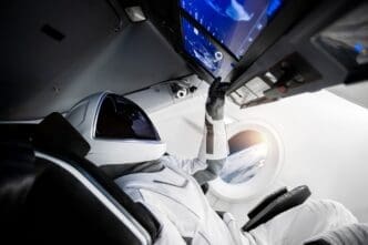 Astronaut on a spaceship flying in outer space. Elements of this image furnished by NASA.