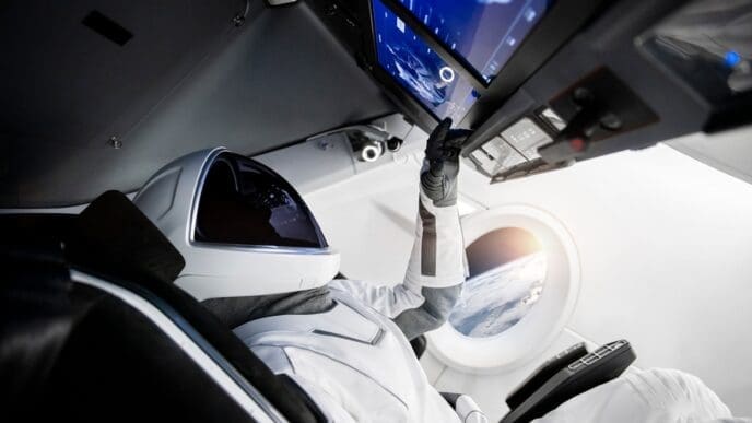 Astronaut on a spaceship flying in outer space. Elements of this image furnished by NASA.