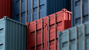 Containers stacked on a cargo freight ship for import and export logistics