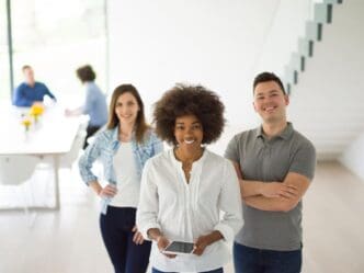 Diverse group of entrepreneurs collaborating on a business plan in a startup office