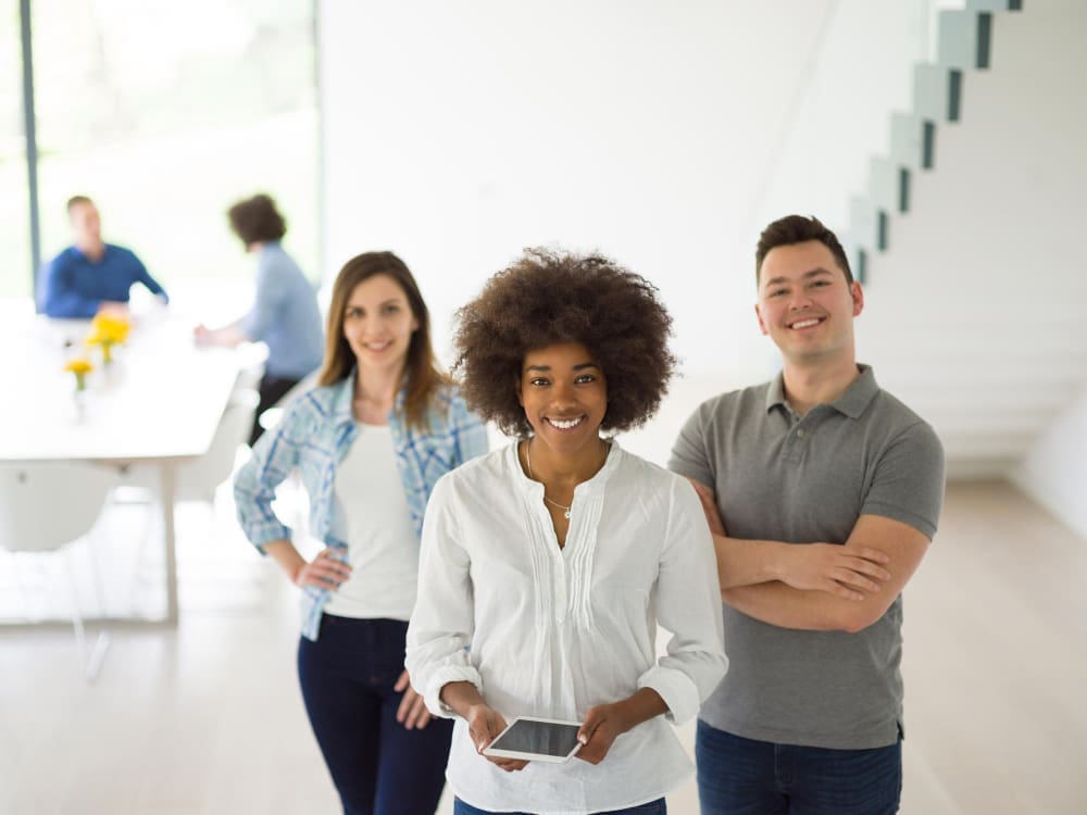Diverse group of entrepreneurs collaborating on a business plan in a startup office