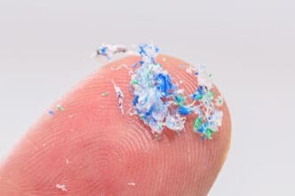 Finger closeup with traces of plastic and microplastic