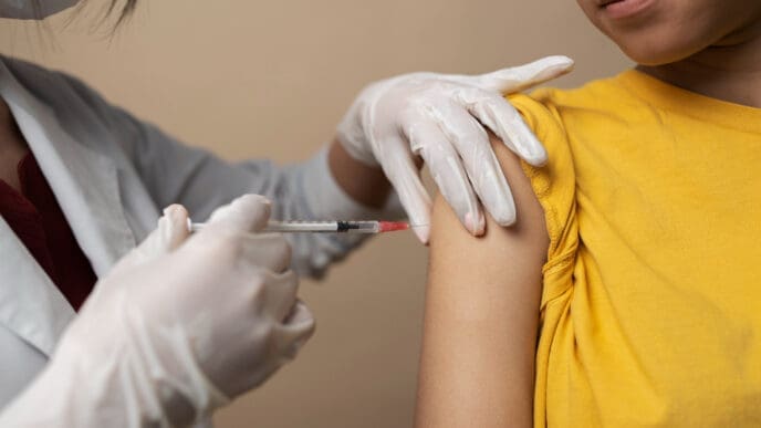 Front view girl getting vaccinated