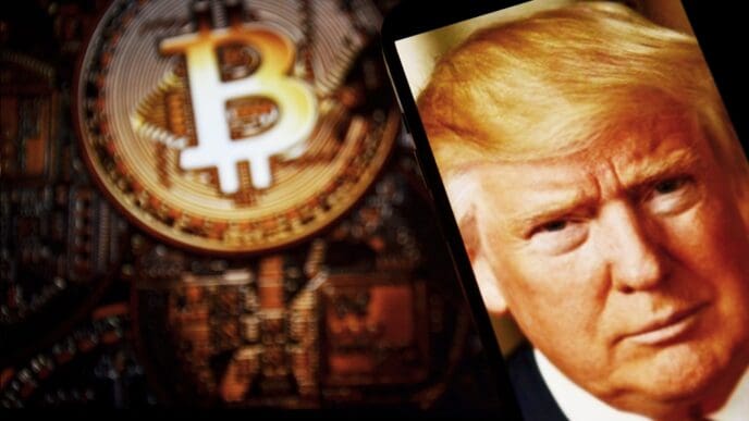 Image of USA President Donald Trump on the smartphone and coins in the background