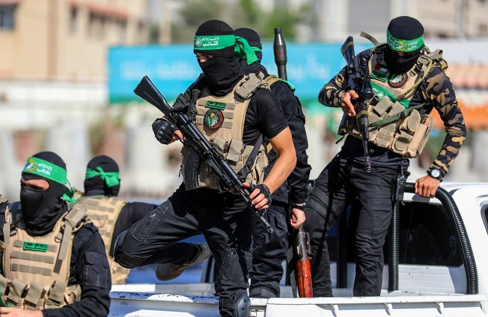 Masked members of the al-Qassam Brigades, the military wing of Hamas, during a march on the 8th anniversary of the kidnapping of the Israeli soldier Shaul Aron in 2014, Gaza City, on July 20, 2022