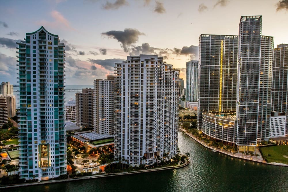 Miami FL - blue hour view of tall buildings in Brickell key, downtown Miami. By Shutterstock.com - Dorinser.