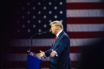 NATIONAL HARBOR, MD, USA- February 24, 2024: Donald Trump speaks at CPAC about his plan for defeating current President Joe Biden in November.