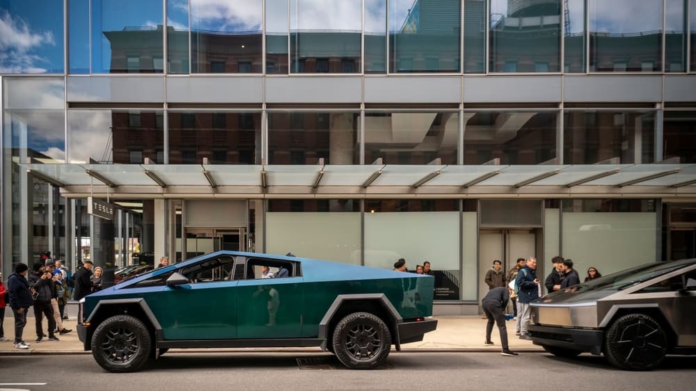New York NY USA-April 6, 2024 Automotive enthusiasts ogle Tesla Cybertrucks on display outside the Tesla showroom in the Meatpacking district in New York