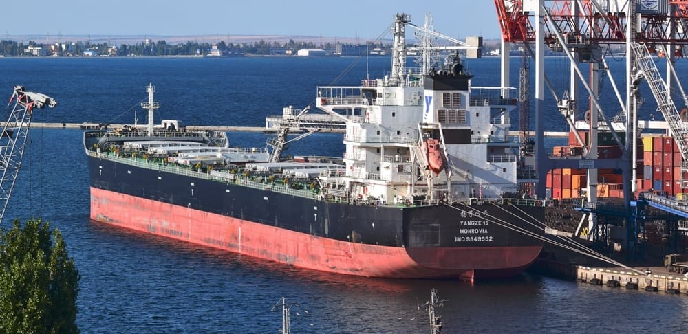 Odessa, Ukraine - Sept 27 2021. Sea transportation of grain. Bulk carrier YANGZE 15 IMO is being loaded with 22708 tons of rapeseed at grain terminal in port of Odessa. By Shutterstock - VolodymyrT