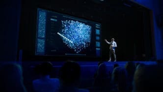 On Stage Speaker Does Presentation of New Product, Talks about Neural Networks, Shows New AI, Big Data and Machine Learning App on Big Screen