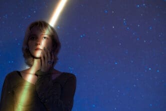 Portrait of a woman with a cosmic backdrop, embodying the midnight concept