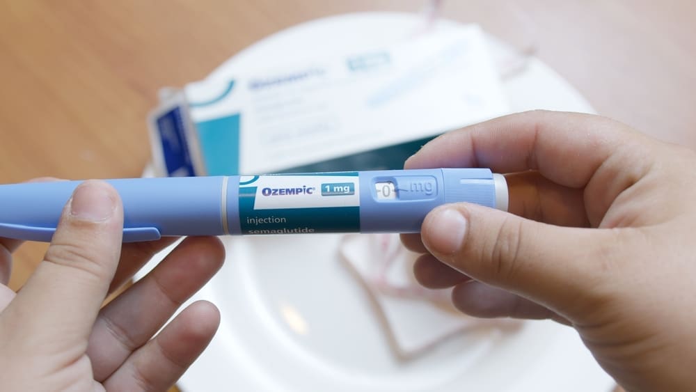 Qawra, Malta - 21.08.2024 - Semaglutide, Ozempic. Drug for diabetes and weight loss. Close up on injector pen in hands. By Shutterstock.com - Starmarpro