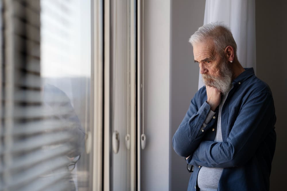 Reflective adult man at home