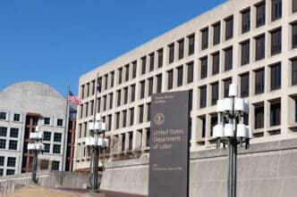 Sign on Constitution Avenue in-front of the US Department of Labor HQ at the Frances Perkins Building in D.C.